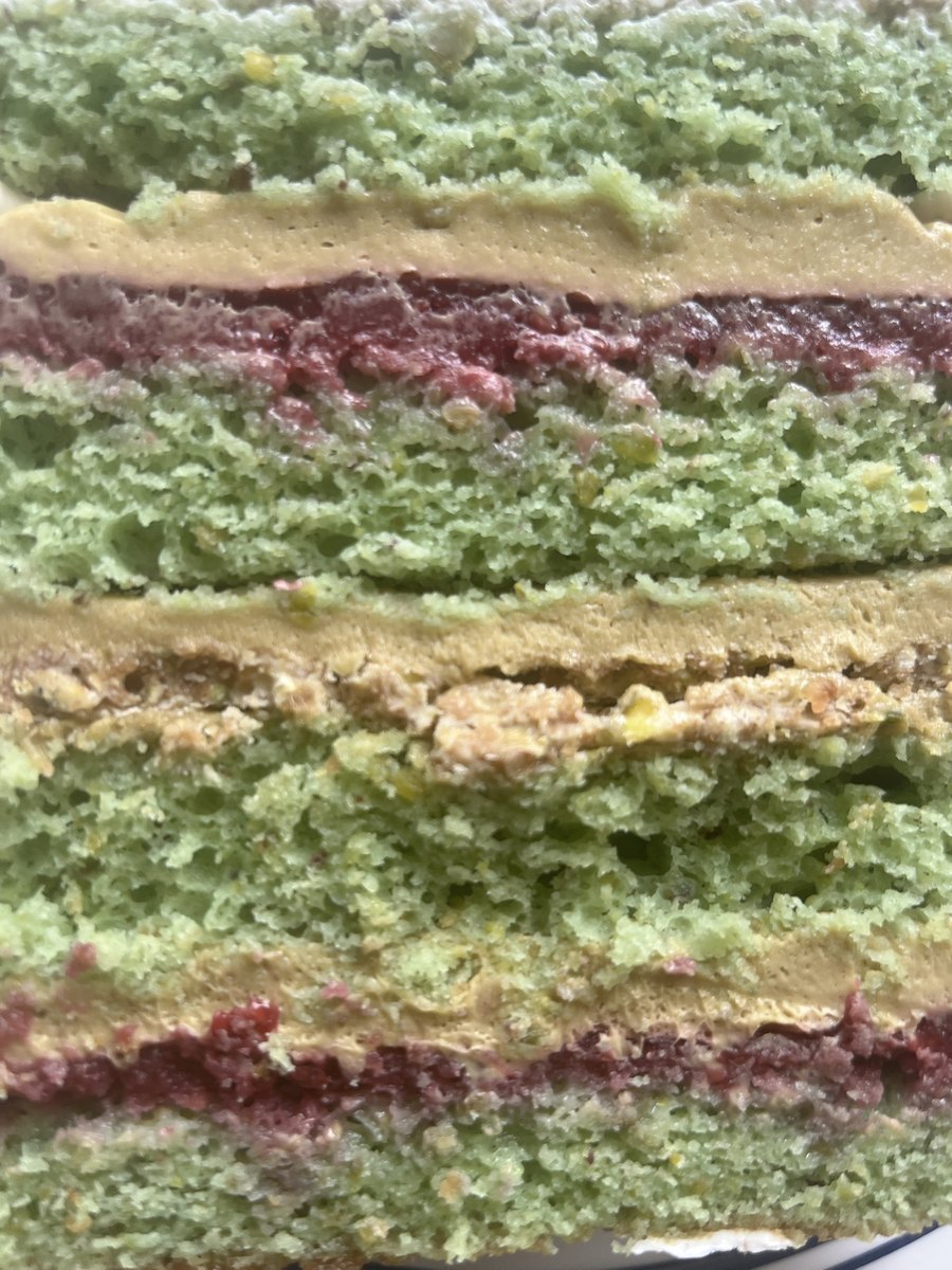 Layers of pistachio cake with raspberry confit